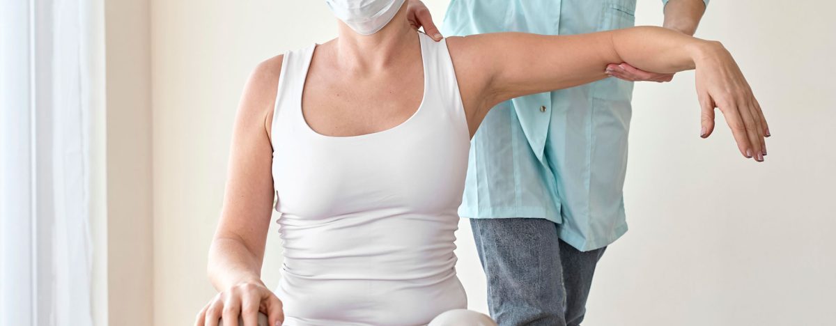 physiotherapist-undergoing-therapy-with-female-patient physiotherapist-undergoing-therapy-with-female-patient
